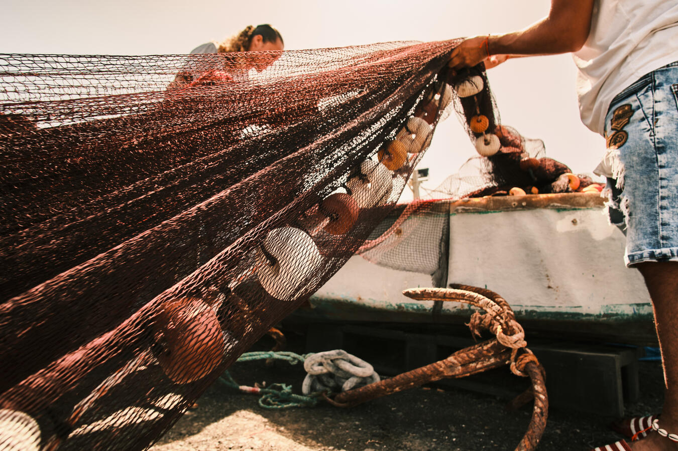 fishermen tidying up the nets